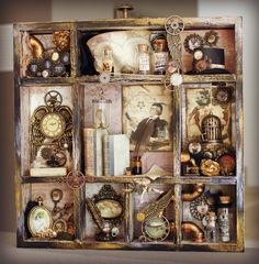 an old wooden box filled with lots of assorted items on top of a table