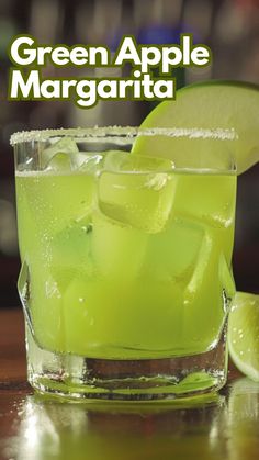 the green apple margarita is garnished with lime