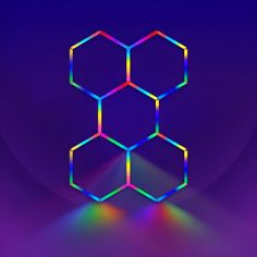 an abstract background with hexagonal shapes in rainbow and blue colors on a dark purple background