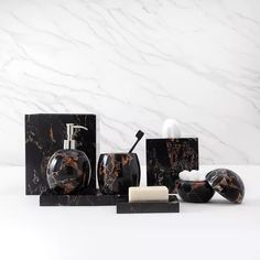 marble bathroom accessories including soap dispenser, soap dish and toothbrush holder