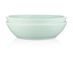 three white bowls sitting on top of each other