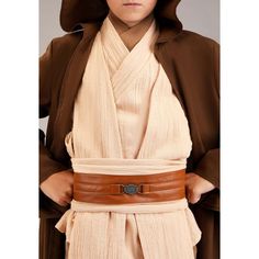 a woman wearing a star wars costume with a belt around her waist and hood on