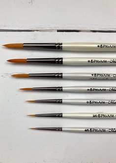 six different types of paint brushes lined up on a white surface, with the words spastic choice written in black