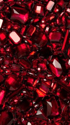 many red crystals are scattered together on the surface, and there is no image to describe