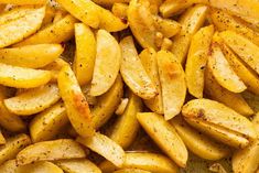 closeup of sliced potatoes with seasoning on them