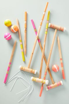 several wooden crayons are lined up next to each other on a white surface