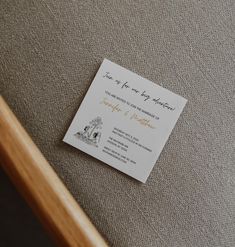 a wedding card laying on top of a chair