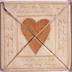 an old envelope with a heart in it