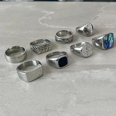 Choose from 8 of our favourite silver rings. ➤Weighty and Durable Stainless Steel ➤The perfect, low key ring for daily wear ➤Multiple Sizes available ➤Made with High Quality 316L Stainless Steel for a premium finish Please Note: This includes 1 ring not a full set of 8. Please pick the style that you would like from the photos. Please check our size chart in the last image before ordering. Shipping: We aim to ship your order out as soon as possible and offer Free First Class Delivery to the UK. Chunky Mens Rings, Detailed Necklace, Silver Signet Ring, Unisex Ring, Onyx Ring, Unisex Jewelry, Mens Accessories Fashion, Ring Set, Mens Jewelry Bracelet