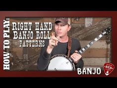 a man holding a banjo in his right hand and pointing to the left with both hands