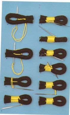 several pieces of black and yellow material with wires attached to the ends, on a blue background