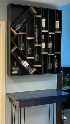 a shelf with bottles and glasses on it