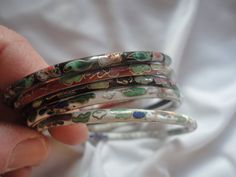 Here we have a Vintage Lot Cloisonne Bangle Enamel Floral Bracelets, Cloisonne, Oriental Bracelets, Chinese Bracelets, Cloisonne Bangle Bracelets, Enamel. There are five bangle bracelets in this lot and all five are good but one of the black ones shows much more wear than the others, the other four show none. All have a floral design and are 2 1/5 inches wide and ready to be worn and what a great Valentine's Day gift... Any questions ask away... Bohemian Enamel Bangle Bracelets, Collectible Enamel Bangle Jewelry, Vintage Enamel Bangle Jewelry, Cloisonne Bracelet, Handmade Vintage Enamel Bangle, Chinese Bracelet, Brown Beaded Necklace, Autumn Necklace, Floral Bracelet