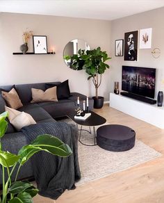 a living room filled with furniture and a flat screen tv