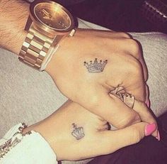 two people with matching tattoos on their hands