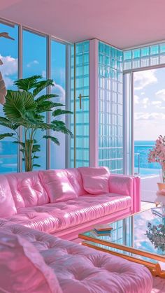 a living room filled with pink furniture and large windows