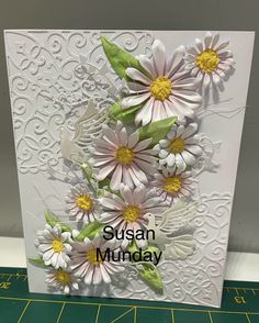 a close up of a card with flowers on it