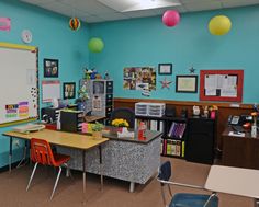 a classroom with desks, chairs and a whiteboard in the middle of it