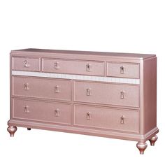 a pink dresser sitting on top of a white floor