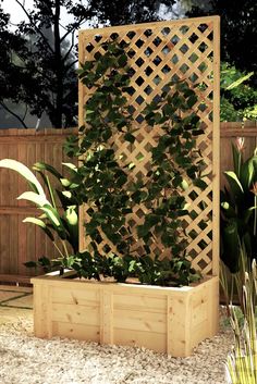 a wooden planter with plants growing on it's sides in a garden area