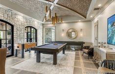 a pool table in the middle of a living room