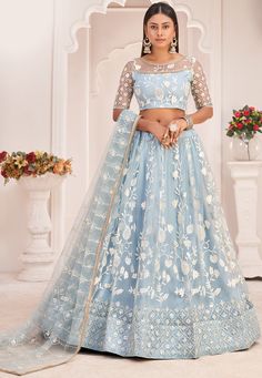 Net Lehenga in Sky Blue This Attire with Poly Shantoon Faux Crepe and Cancan is Beautifully Enhanced with Resham, Zari, Sequins and Patch Border Work Available with an Semi-Stitched Net Choli and a Net Dupatta in Sky Blue, Crafted in Round Neck and Half Sleeve The Semi-stitched Lehenga Waist and Hips are Customizable from 28 to 38 and 36 to 46 inches respectively and Its Length is 42 inches Do note: Accessories shown in the image are for presentation purposes only.(Slight variation in actual col Sky Blue Lehenga, Aqua Blue Wedding, Sky Blue Weddings, Bridal Lehenga Online, Bridesmaid Lehenga, Lehenga Choli Designs, Prom After Party, Bollywood Lehenga