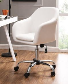 a white office chair sitting on top of a hard wood floor next to a desk