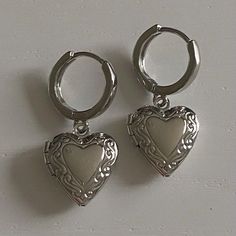 SIZE: 4 cm from top to bottom, lockets are 1.5 x 1.5 cm. MATERIAL: hoops and charms are both rhodium plated stainless steel (hypoallergenic & tarnish resistant).  POSTAGE INFO: these earrings are handmade with love by me in perth, western australia. PACKAGING: all jewellery is placed inside a storage box and packaged in cardboard and paper packaging. STORAGE & CARE: i would recommended storing your earrings in a cool, dry place, away from moisture. a reminder to please be gentle when handling ea Silver Vintage Locket, Vintage Earrings Silver, Silver Charm Earrings, Cool Earrings, Vintage Heart Jewelry, Heart Locket Necklace