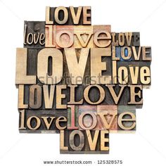 the word love written in multiple different languages on wood blocks with an image of a cross and