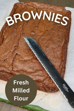 a tray of uncut baked fresh milled flour brownies with a long knife sitting on top. Groats Recipe, Wheat Berry Recipes, Fresh Milled Flour, The Best Brownies, Einkorn Recipes, Einkorn Flour, Wheat Bread Recipe, Wheat Recipes, Brownie Ingredients