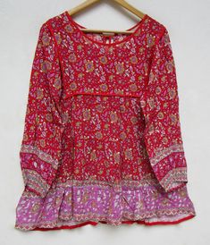 "ITEM DESCRIPTION pink red floral printed rayon bohemian women blouse and tops - boat neckline with back tassel blouse - long sleeve summer blouse and tops Features : Long sleeve, boat neck, Blouse Material : rayon crepe Fabric: 100% rayon soft light weight ethnic print fabrics Sleeve Length = 22 inch For more sizes & their measurement, please refer our below chart to understand the sizes variations available with us For your size requirement, please mention your size in seller note at the t Long Sleeve Printed Peasant Top For Vacation, Bohemian Long Sleeve Floral Print Top, Festival Floral Print Rayon Blouse, Long Sleeve Rayon Peasant Top With Floral Print, Bohemian Long Sleeve Peasant Top With Floral Print, Flowy Floral Print Peasant Top For Festivals, Red Boho Print Tops For Vacation, Pink Floral Print Rayon Blouse, Flowy Long Sleeve Rayon Peasant Top