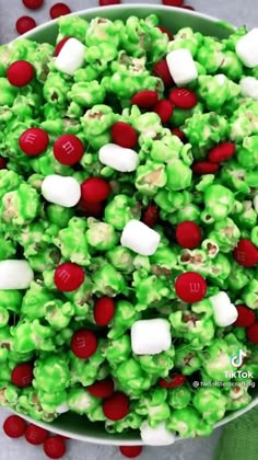 a bowl filled with green and red candy