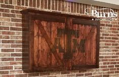 a brick wall with a wooden door on it