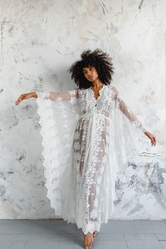 "Clarisa is a classic from our Bibiluxe lace collection  An all over embroidered ivory lace kaftan, with a stunning scallop border all around. * Unlined Kaftan only  *Available in 3 lengths    44' mid length    53\" petite maxi length    59\" tall maxi length ( model is wearing 59\" length )   * Made to Order approx 2-3 weeks * Custom sizes available please enquire SIZES  SMALL / MEDIUM Fits Hips / Bust to up to 40\" FITS UK sizes 6-10 / Euro 34-38 / US 4-8  Actual garment measurements bust / hi V-neck Lace Gown With Lace Trim, V-neck Sheer Wedding Gown, Long Lace Robe For Wedding Night, White Lace Robe With Delicate Details, V-neck Delicate Lace Maxi Dress For Wedding, Sheer Lace Wedding Robe, Sheer Lace Wedding Night Gown, Sheer Long Wedding Dress, Long Sheer Wedding Dress