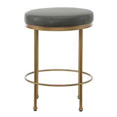 the backless stool has a black leather seat and gold metal frame, with a round foot rest