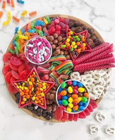 colorful candies and candy are arranged on a plate