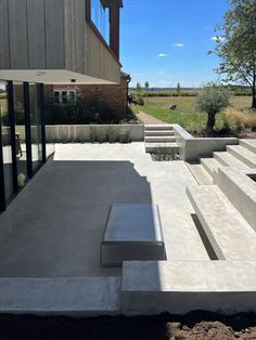 concrete steps leading up to the side of a house