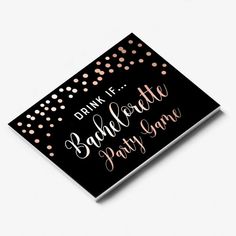 a black and gold bachelor party sign with confetti on it's side