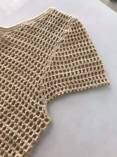 a knitted piece of cloth sitting on top of a table