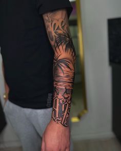 a man with a palm tree tattoo on his arm