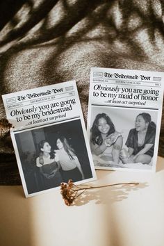 two newspaper pages sitting on top of a table