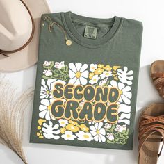 The Comfort Colors Second Grade Teacher Shirt, adorned with a charming floral design, is perfect for educators in their second year. This 2nd Grade Teacher Shirt, ideal for the whole 2nd Grade Teacher Team, combines style and comfort seamlessly. 🌟 Step into your second year with flair and grace! The Comfort Colors Second Grade Teacher Shirt is here to redefine classroom chic! 🎨 Imagine a shirt that blends the tranquility of floral designs with the vibrancy of your teaching spirit. Perfectly crafted for the dynamic 2nd Grade Teacher Team, this shirt isn't just attire--it's an expression! ✨ Envision yourself leading your classroom in unparalleled comfort and style. The Comfort Colors Second Grade Teacher Shirt promises to be as enduring and inspiring as your lessons. Feel the difference, s Teacher 2nd Grade Shirts, 3rd Grade Teacher Shirts, Tee Ideas, 2nd Grade Teacher, Teacher Team, Second Grade Teacher, Team Shirt, Teacher Outfits, Team Shirts