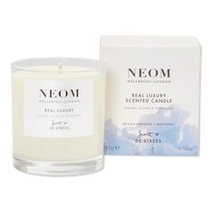 neom scented candle with box on white background