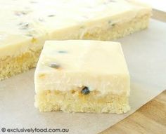 two pieces of cake sitting on top of a cutting board