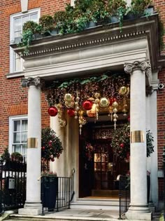 an entrance to a building decorated for christmas