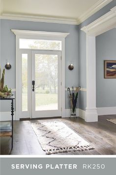 a living room filled with furniture and a white door