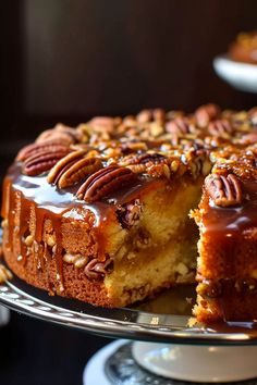 a close up of a cake on a plate with a slice missing from the cake