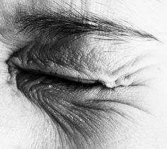 the eye of an old woman with wrinkles