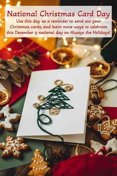 a christmas card with a tree on it next to cookies and other holiday decorations in the background