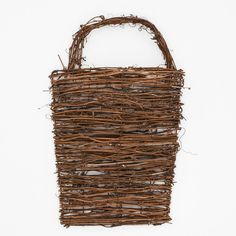 a basket made out of twigs on a white background